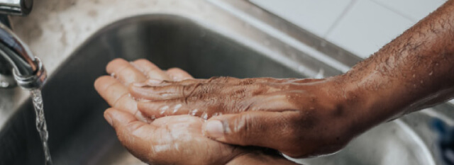 man washing his hands