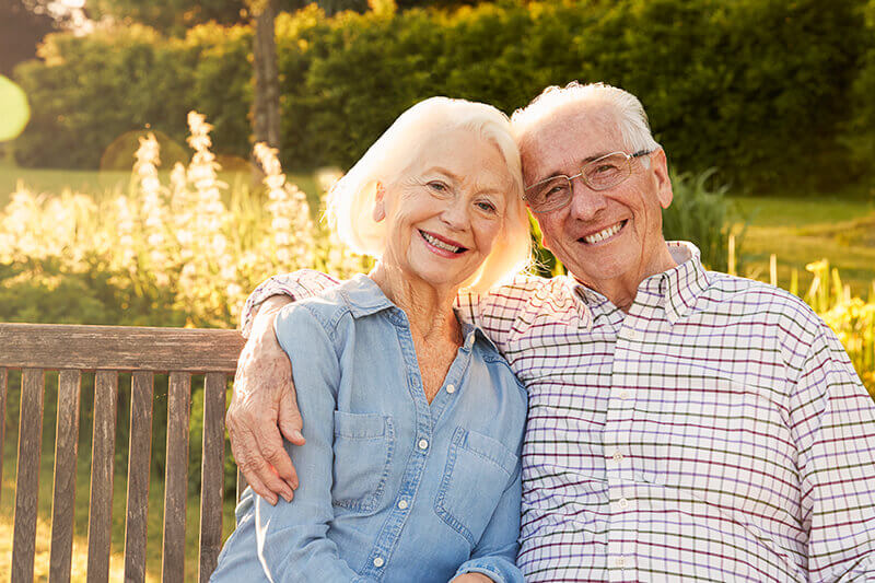 Elderly man and woman with dentures